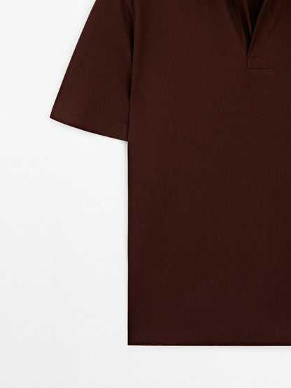 Textured polo shirt with hidden button