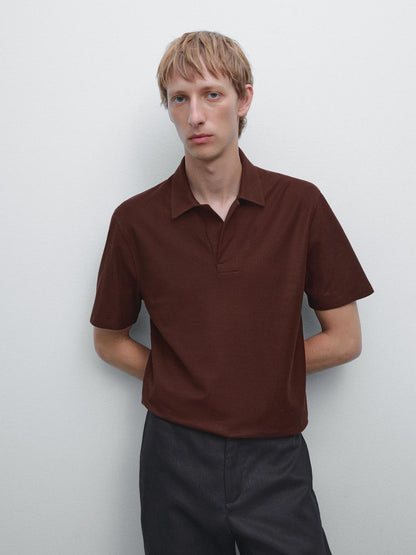 Textured polo shirt with hidden button