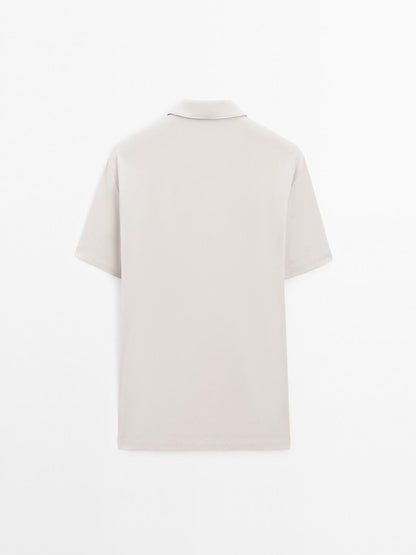 Short sleeve polo shirt with snap-button placket