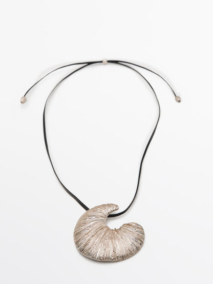 Necklace with fossil piece pendant