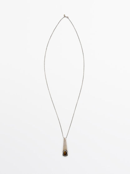 Geometric pendant with stone