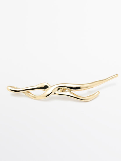 Abstract metal brooch