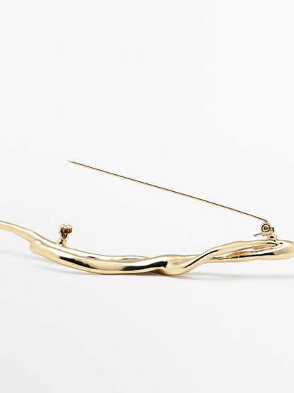 Abstract metal brooch