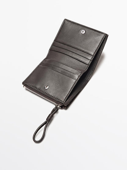 Animal print hair on leather wallet