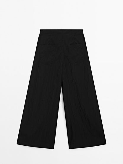 Flowing palazzo trousers with darts