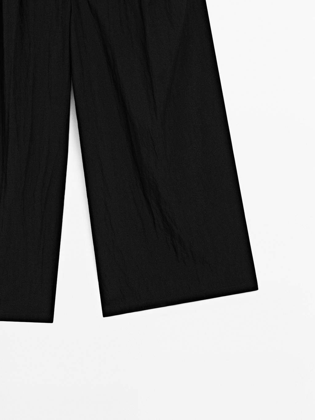 Flowing palazzo trousers with darts