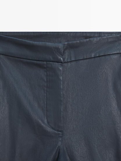 Waxed flare fit trousers