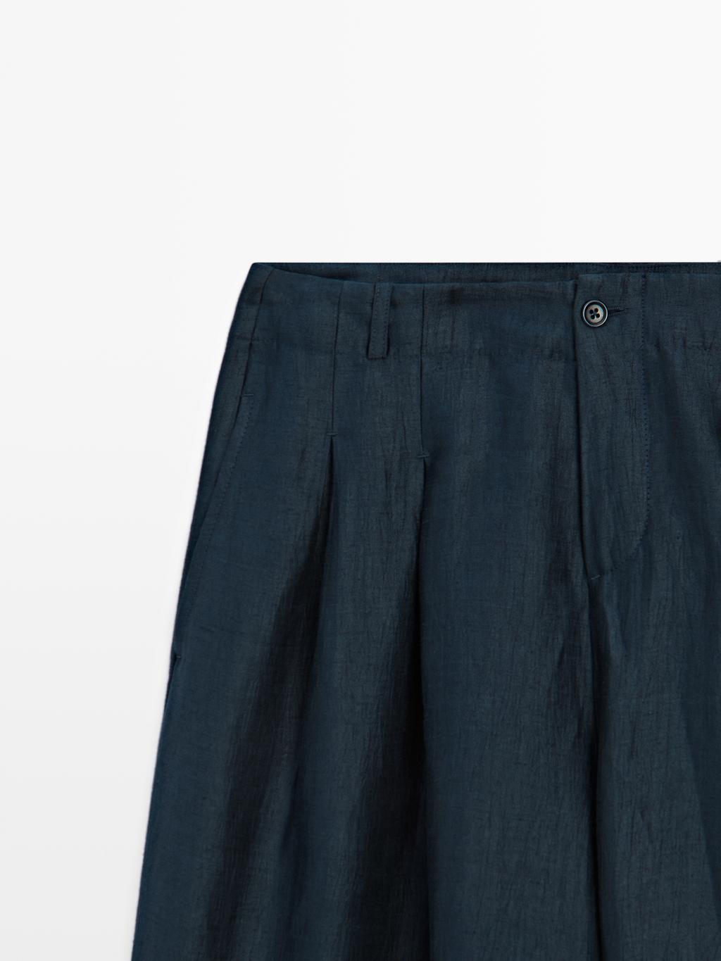 Loose-fitting linen blend trousers