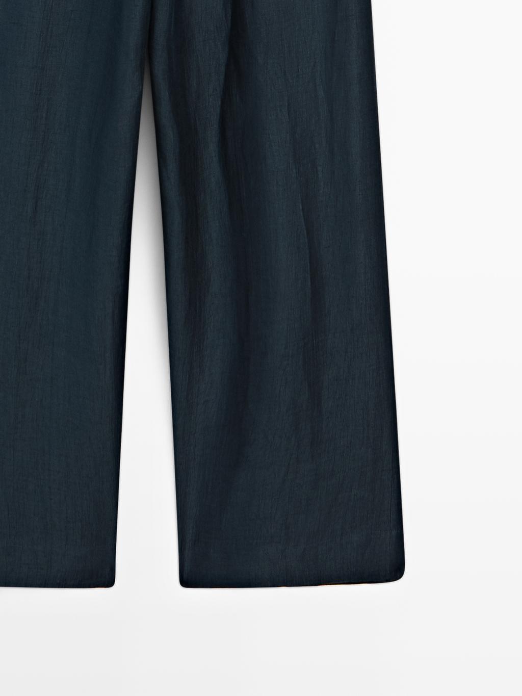 Loose-fitting linen blend trousers