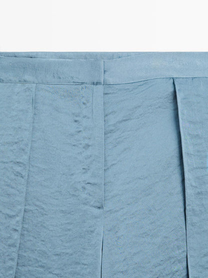 Flowing palazzo trousers with slits