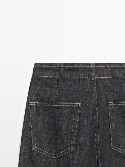 High-waist wide-leg jeans with chains