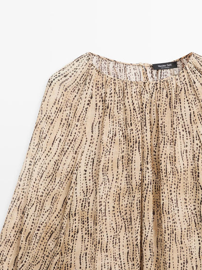 Semi-sheer draped blouse