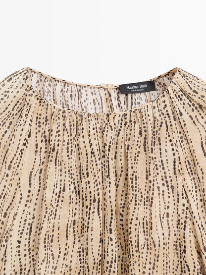 Semi-sheer draped blouse