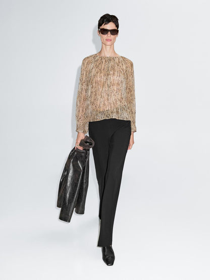 Semi-sheer draped blouse