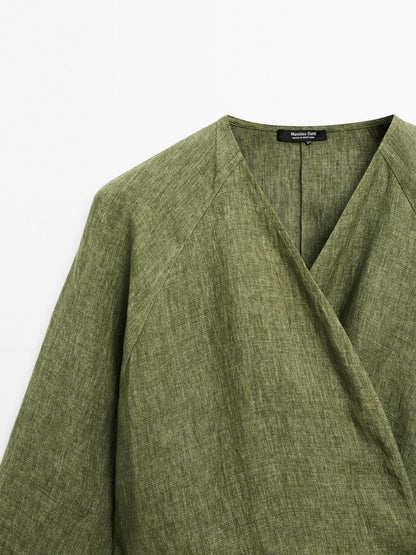 Flowing linen blouse with tie detail at the waist