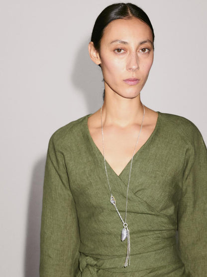 Flowing linen blouse with tie detail at the waist