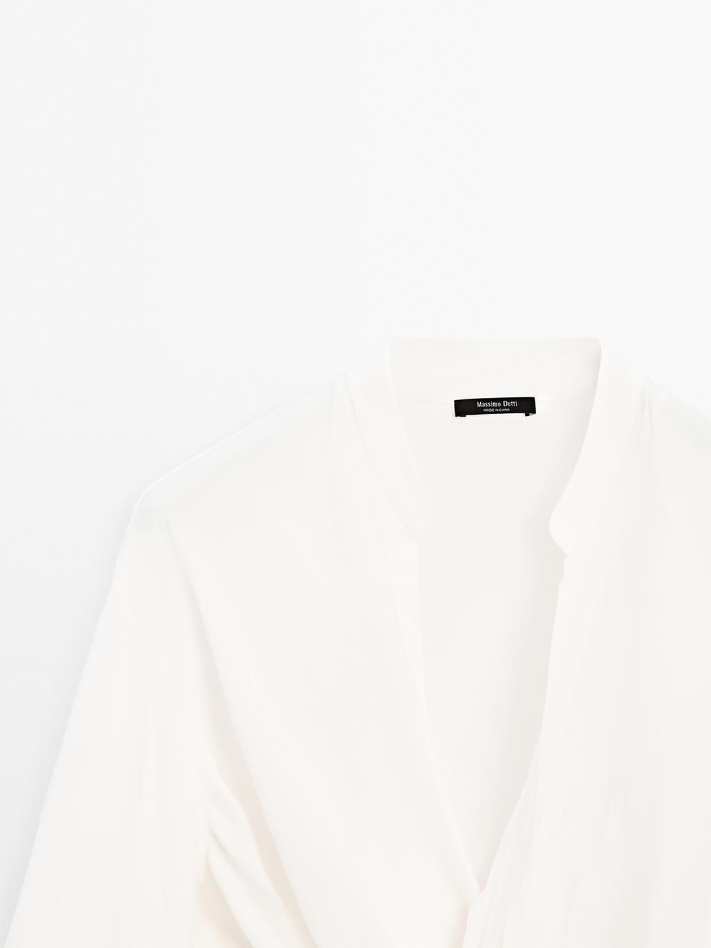 Blouse with knotted neckline and brooch detail