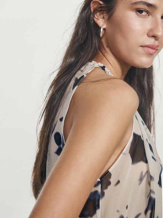 Asymmetric flowing floral print blouse