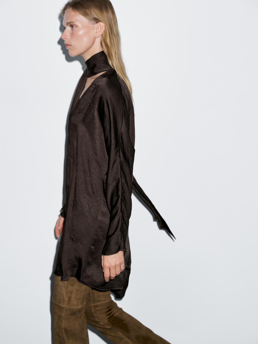 Long flowing blouse with tied neck