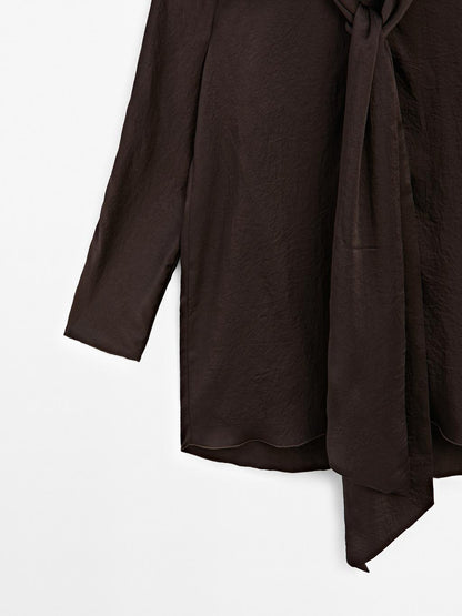 Long flowing blouse with tied neck