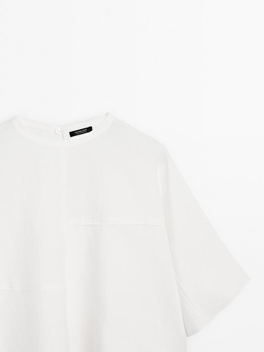 Short cape with seam details