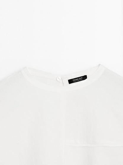 Short cape with seam details