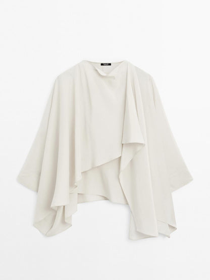Short flowing cape with sleeve detail
