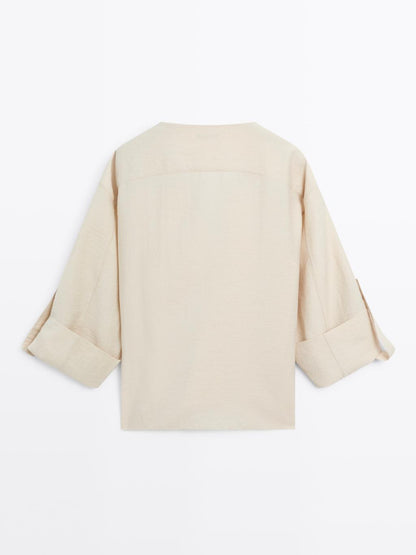 Shirt with rolled-up sleeves