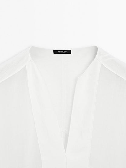 Flowing linen blend blouse with seam details
