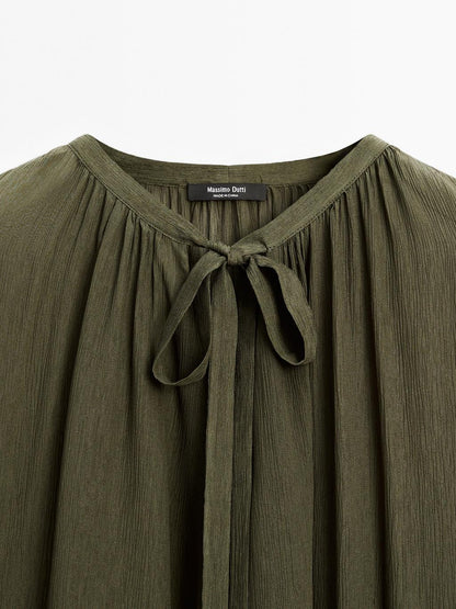 Cape blouse with ties