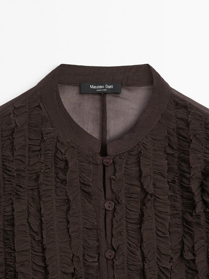 Flowing bib-front shirt with ruffles