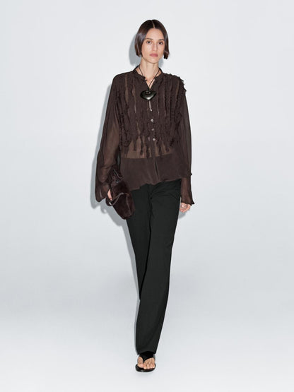 Flowing bib-front shirt with ruffles