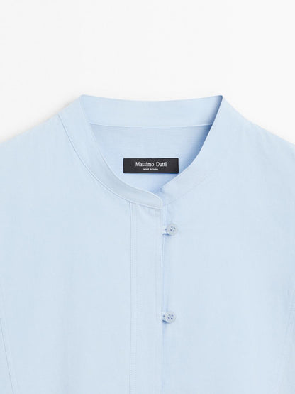 Shirt with stand collar and bib