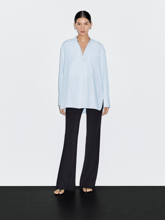 Shirt with stand collar and bib