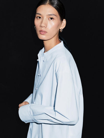 Shirt with stand collar and bib