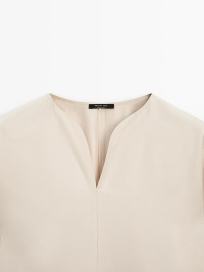 Flowing blouse with slit details