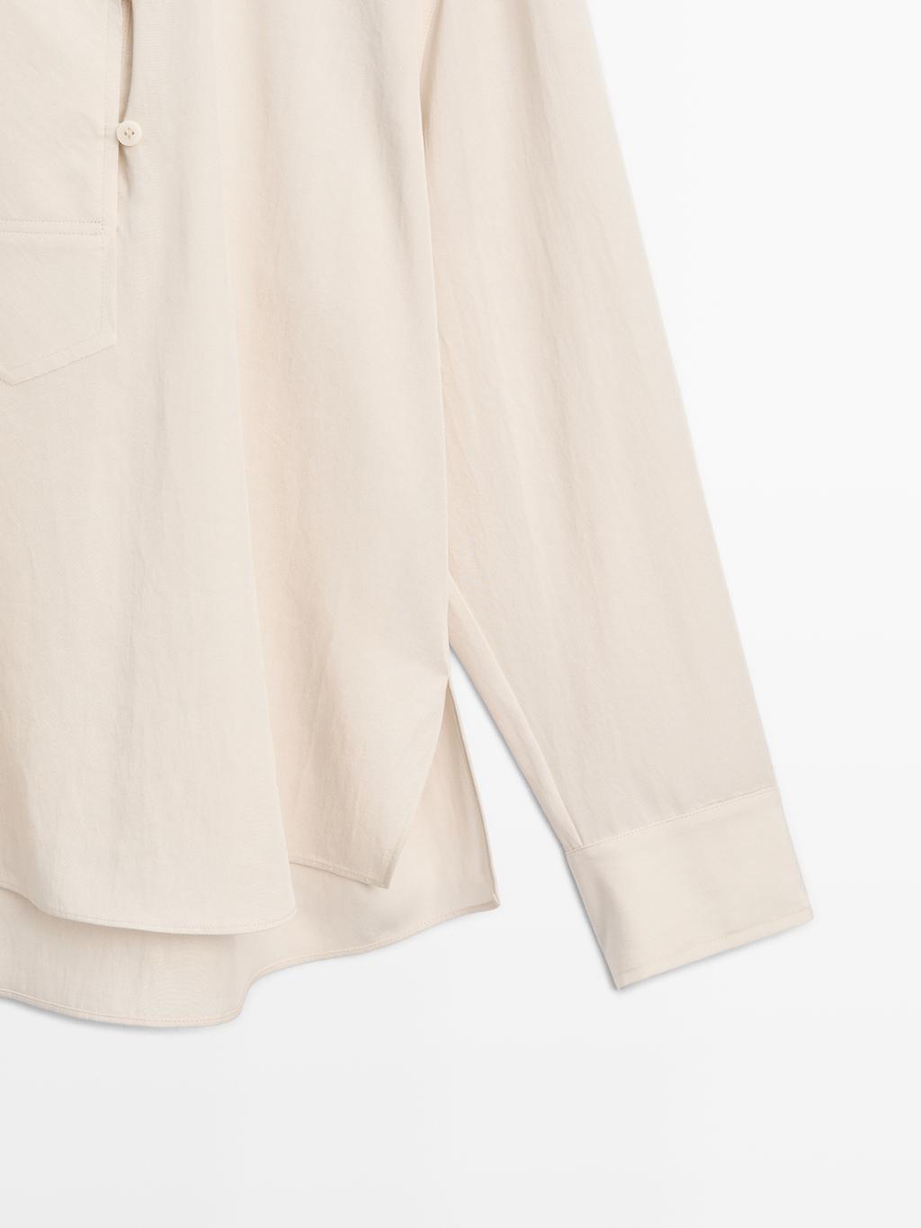 Flowing blouse with button detail