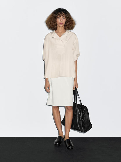 Flowing blouse with button detail