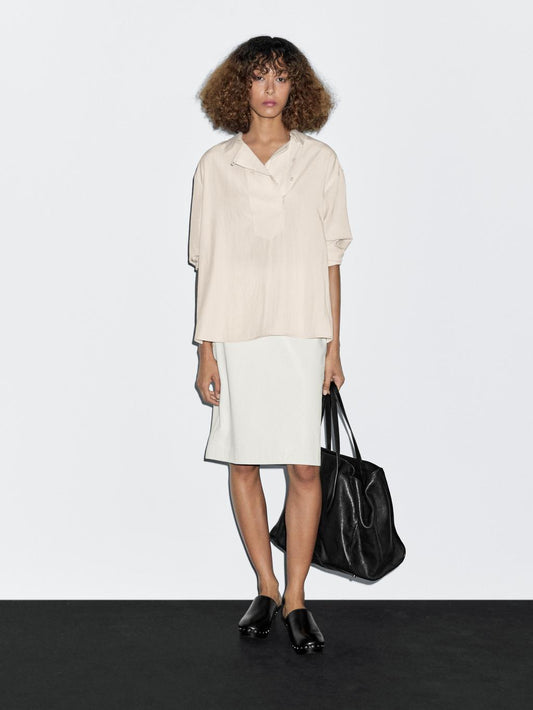 Flowing blouse with button detail