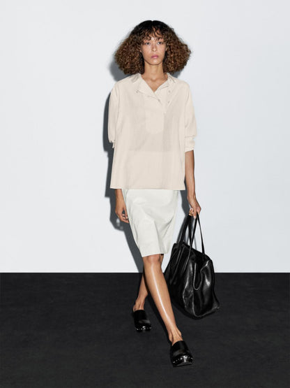 Flowing blouse with button detail