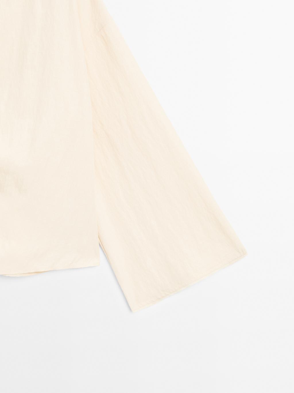 Long sleeve blouse with side button fastening