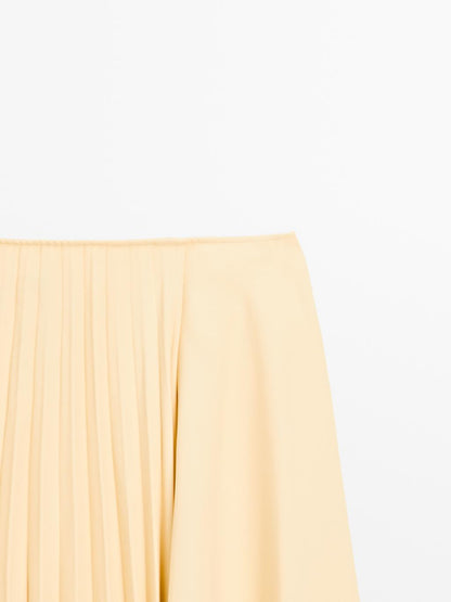 Asymmetric box pleat skirt