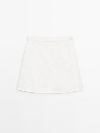 Short denim skirt with seam details