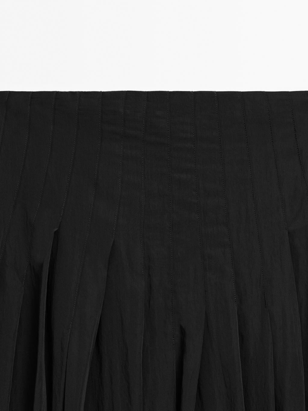Flowing midi skirt with box pleats