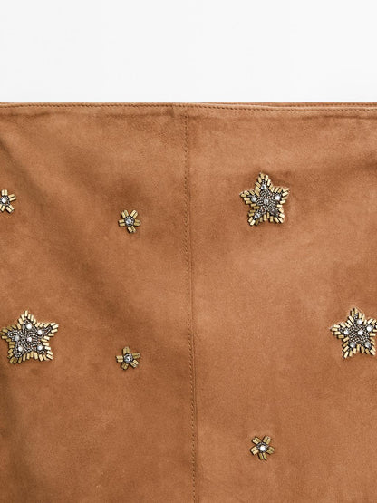 Suede leather skirt with rhinestone detail