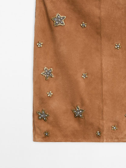 Suede leather skirt with rhinestone detail