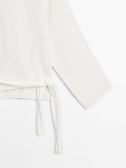 Knit sweater with bow detail