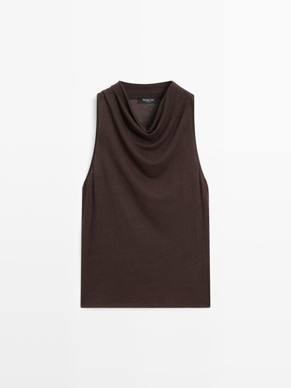 Sleeveless top with draped neckline