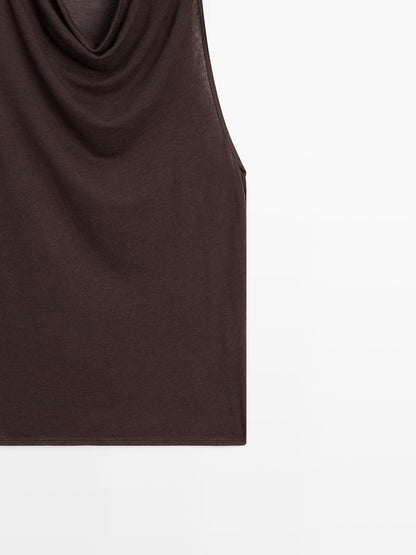 Sleeveless top with draped neckline
