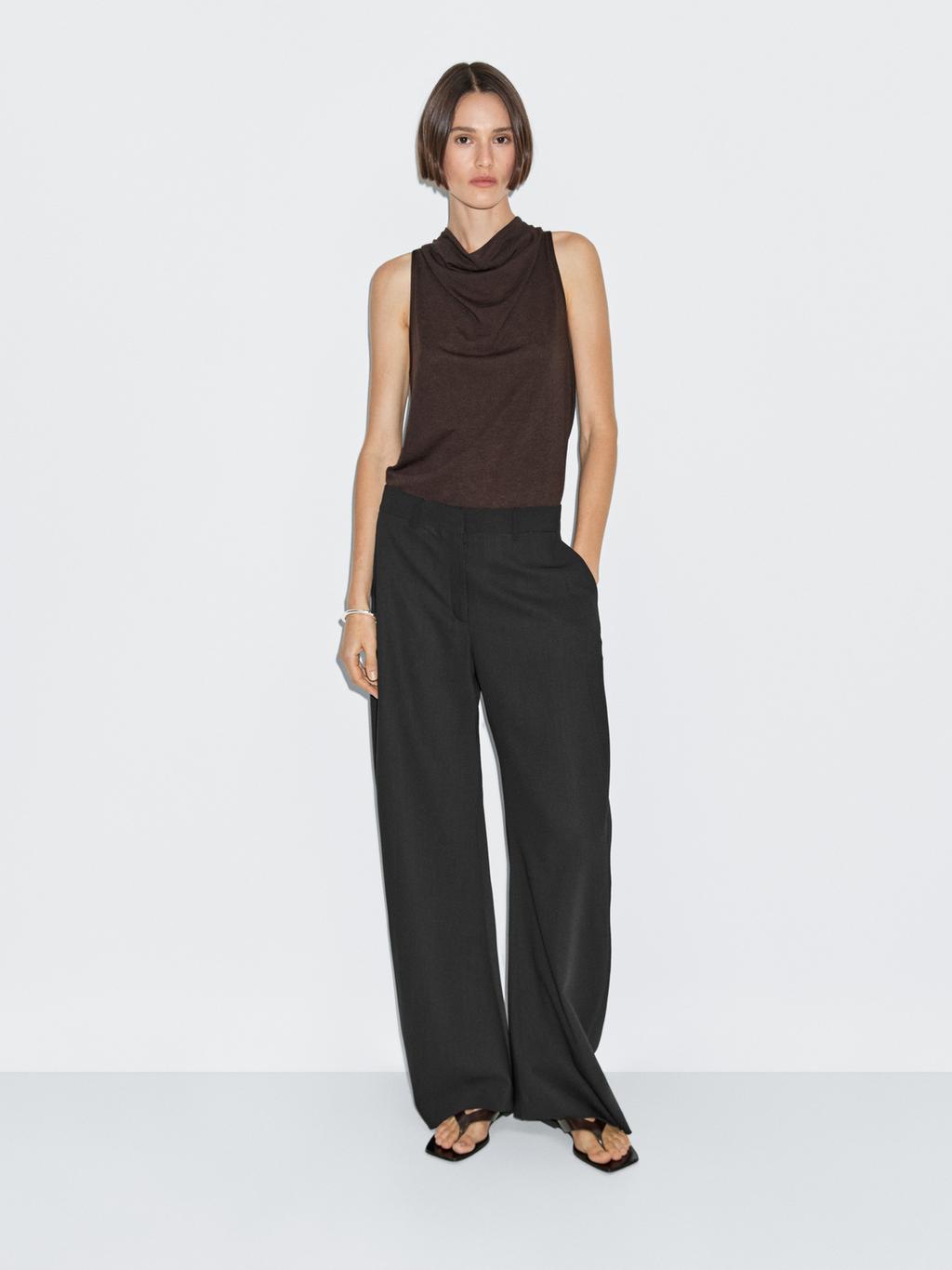 Sleeveless top with draped neckline